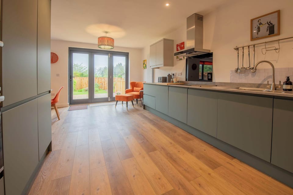 The spacious kitchen offers plenty of room to cook, socialise and settle in comfortably during both short and extended stays.