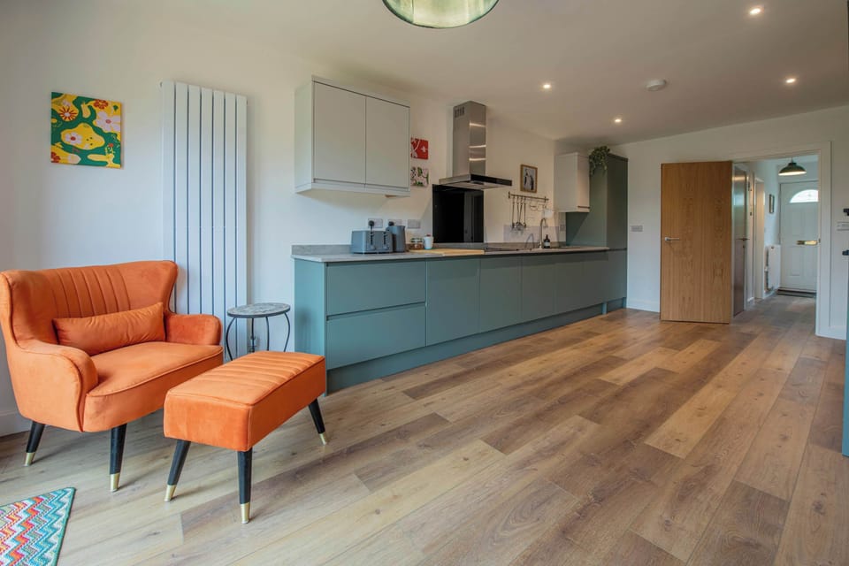 Start slow mornings with fresh coffee in the bright open plan kitchen, designed for relaxed family stays and longer contractor visits alike.