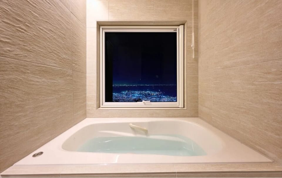 Combined shower/tub, free toiletries, hair dryer, slippers