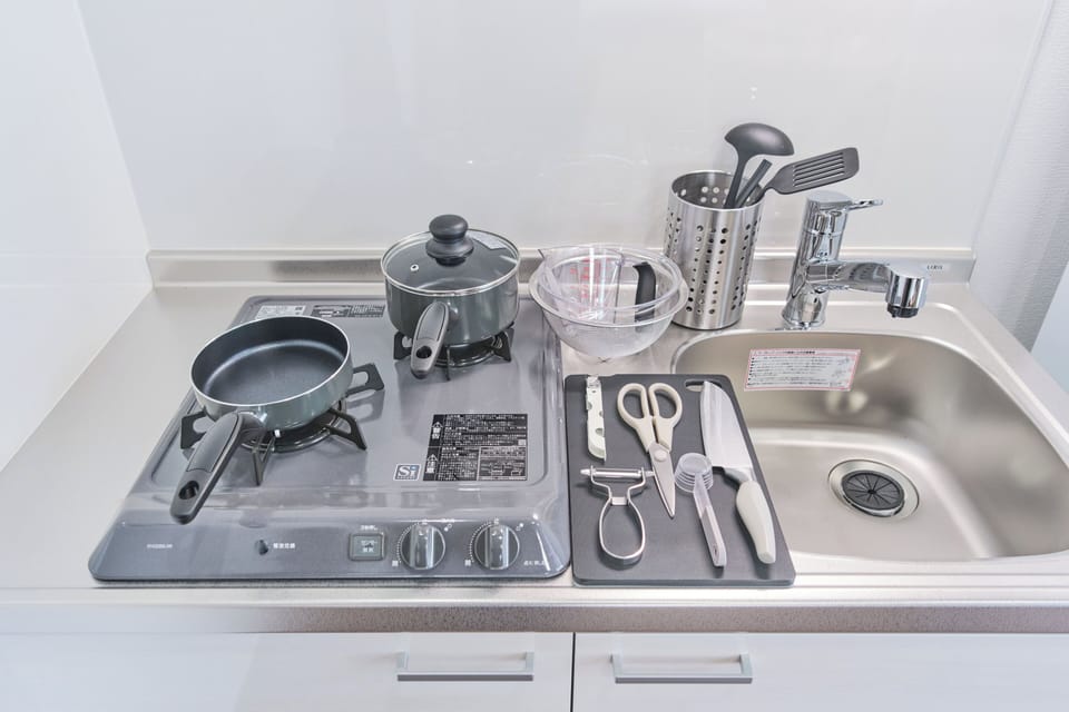 Fridge, microwave, stovetop, cookware/dishes/utensils