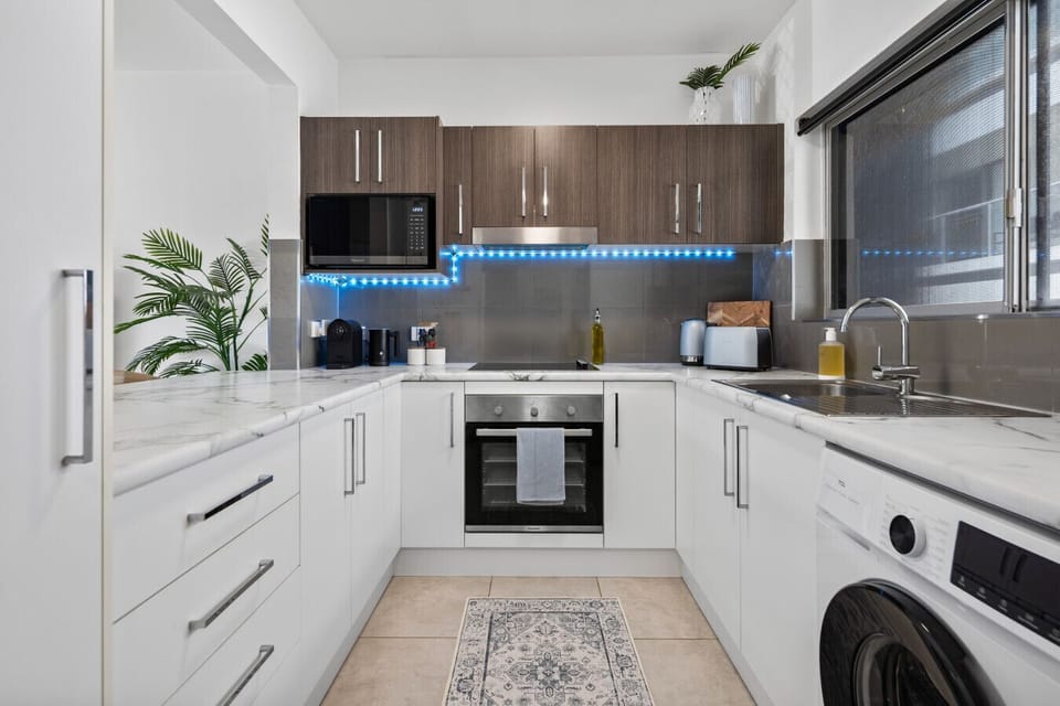 Fully equipped kitchen with quality appliances and in-unit washer
