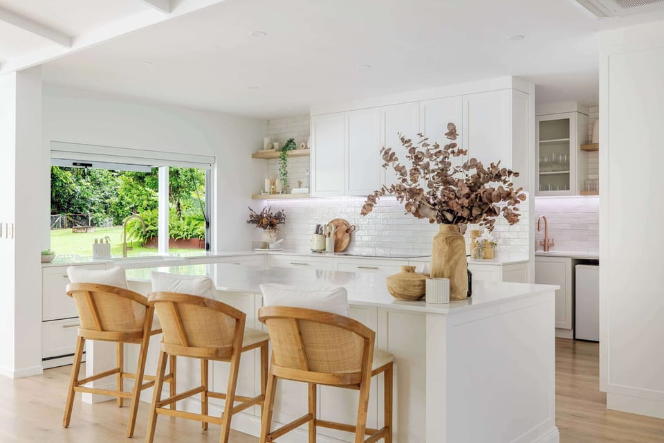 Gather around the oversized kitchen island with stools for slow morning coffees, casual breakfasts, and easy conversation while meals come together nearby.