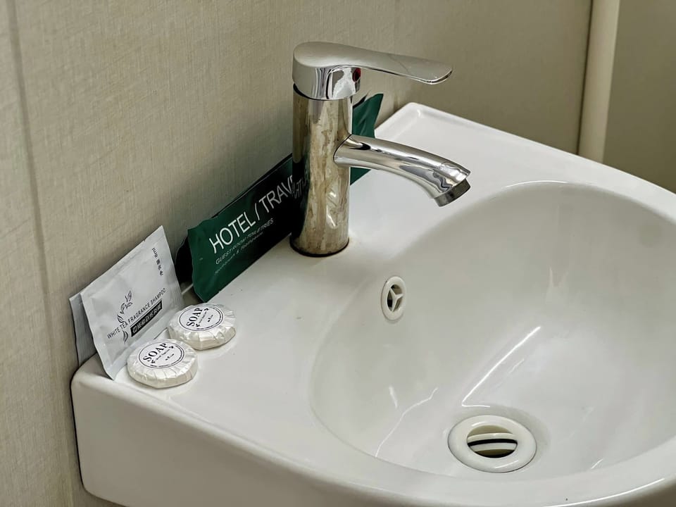 Junior Double or Twin Room, Partial Sea View | Bathroom | Shower, towels, soap, shampoo