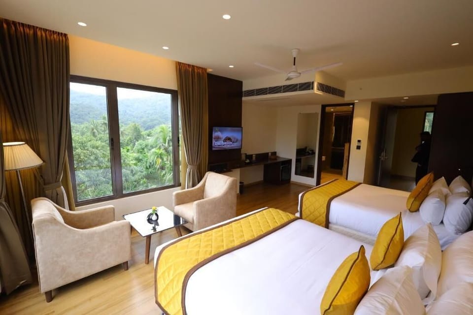 Premium Quadruple Room, Hill View | Premium bedding, down comforters, memory foam beds, minibar