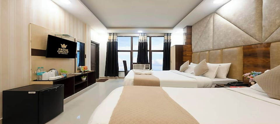 Deluxe Double or Twin Room, City View | In-room safe, desk, laptop workspace, blackout drapes