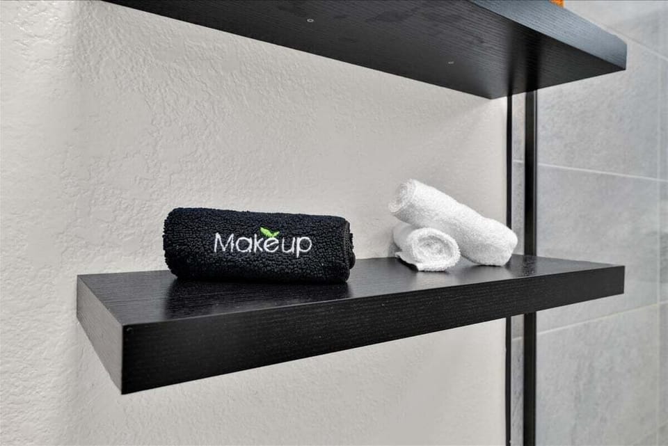 Thoughtful bathroom touches with makeup towels and open shelving
