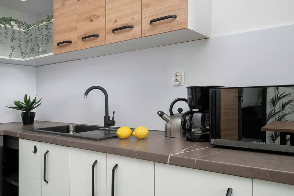 A detailed view of kitchen countertops and cabinetry. Everything is modern and well-organized.