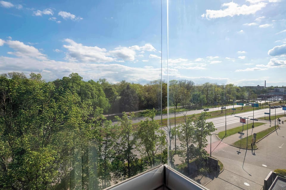 Another balcony view with surrounding landscape and sky. It provides a nice outdoor perspective.