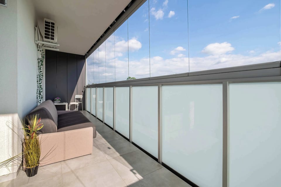 A balcony seating area with an open view, perfect for enjoying quiet moments outdoors. It offers a comfortable space to unwind and take in the surroundings.