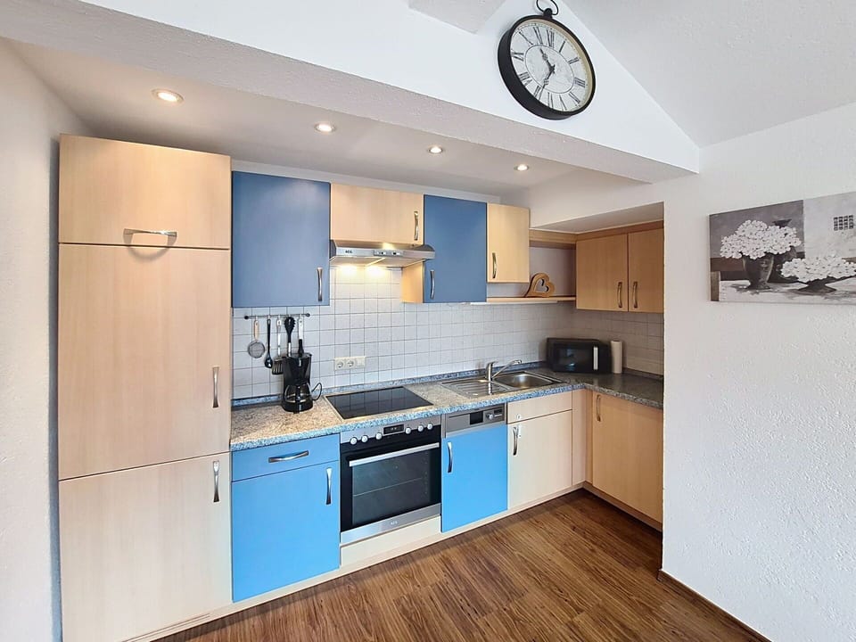 Kitchen, Countertop, Kitchen Appliance, Major Appliance, Cabinetry, Interior Design, Wood, Furniture, Flooring, Kitchen Stove