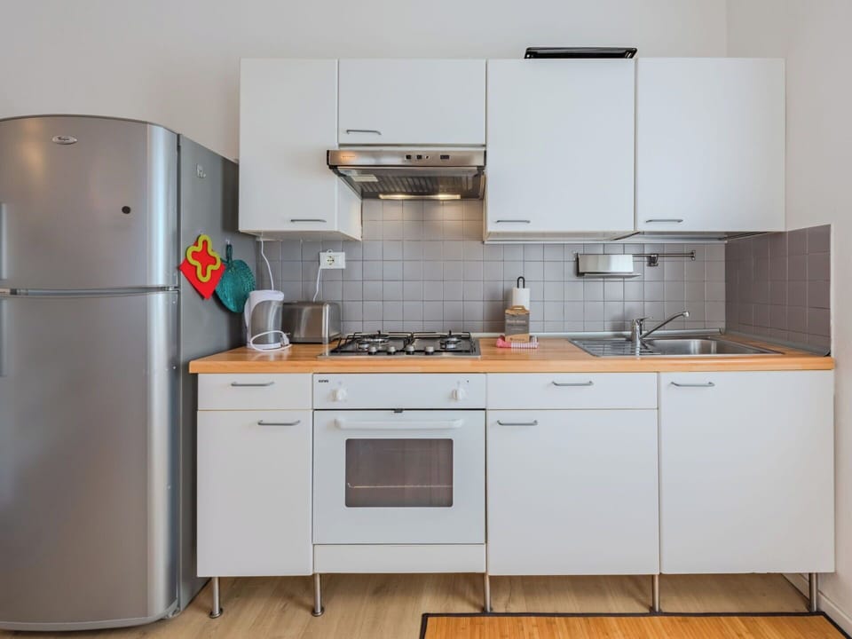 Kitchen Appliance, Kitchen, Countertop, Major Appliance, Cabinetry, Kitchen Sink, Interior Design, Kitchen Stove, Flooring, Wood