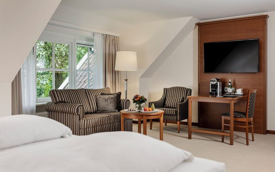 Relax with cozy armchairs and a big-screen evening escape