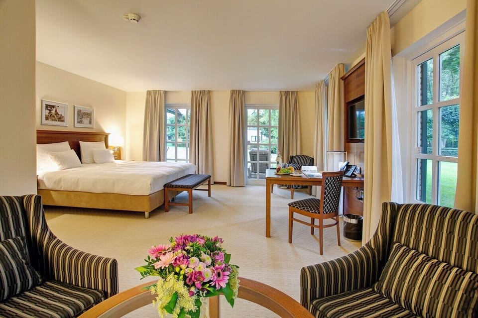 Stretch out in a sunlit suite with calming garden outlooks.