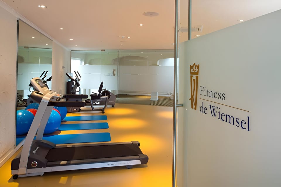 Start strong with cardio machines and space for stretching.