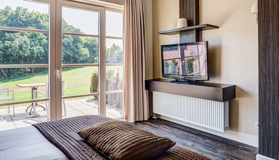 Enjoy a movie in bed with daylight streaming in.