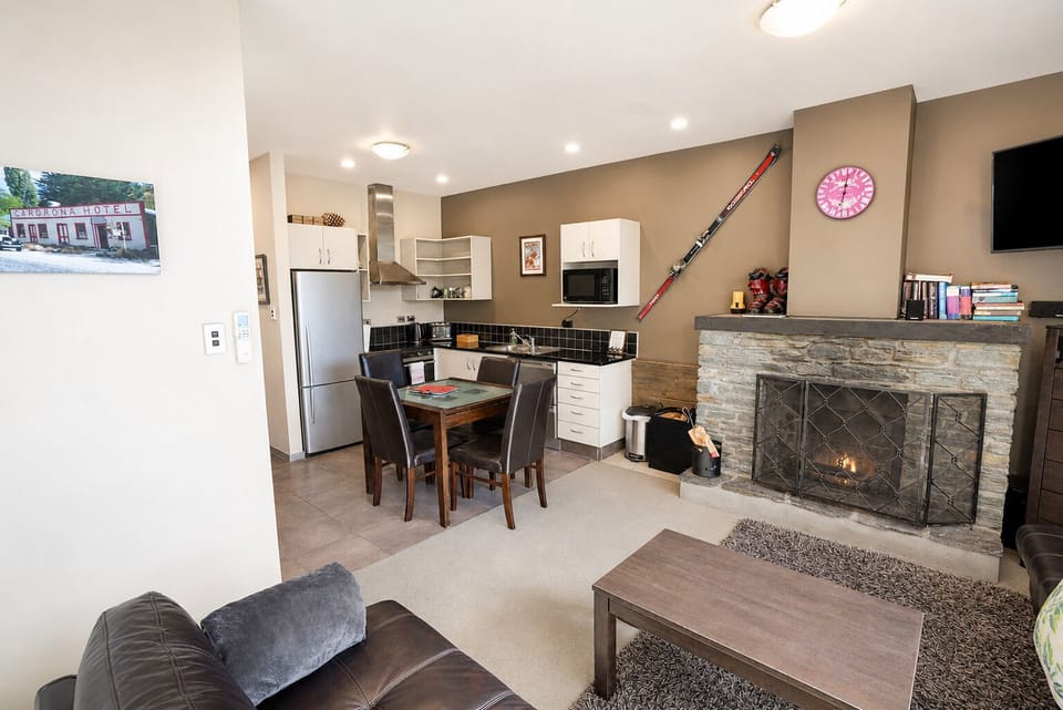 open living room and kitchen with a nice cozy fire place