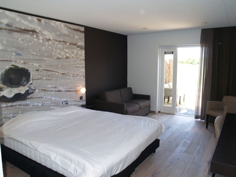 Recharge in a tranquil room with lounge seating and garden light.