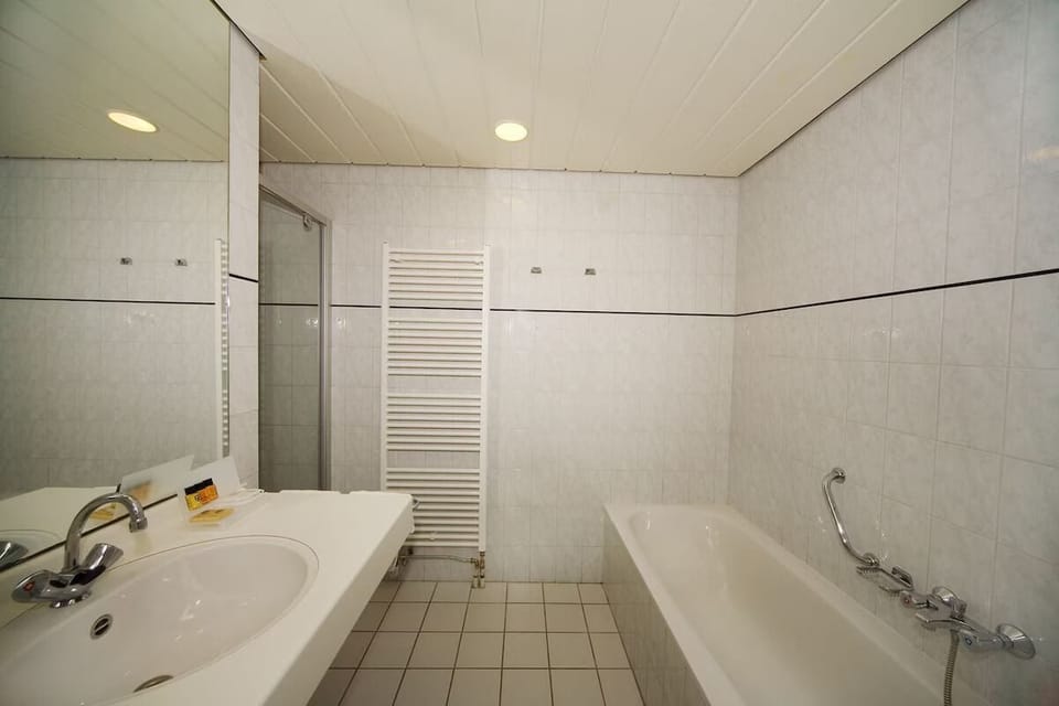 Soak and reset in the clean, bright bath after adventures.