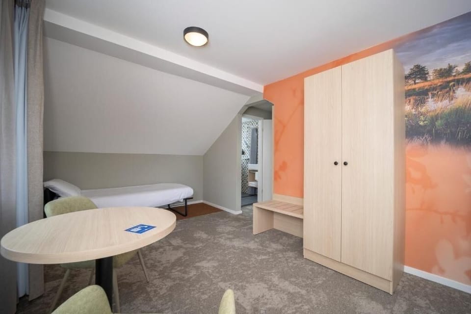Stretch out with convenient seating and a quiet extra single bed.