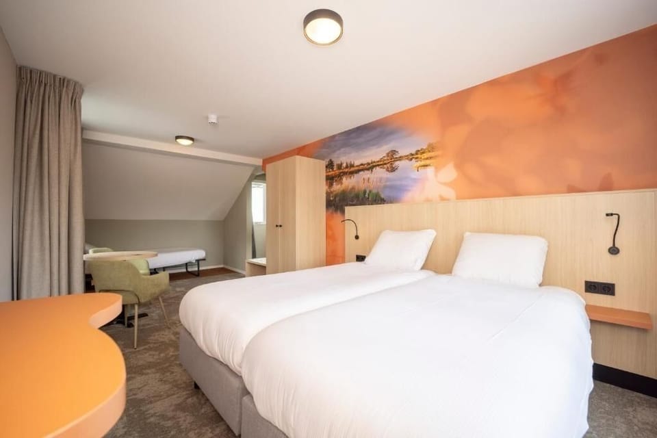 Unwind in airy twin beds with cozy sitting nook.