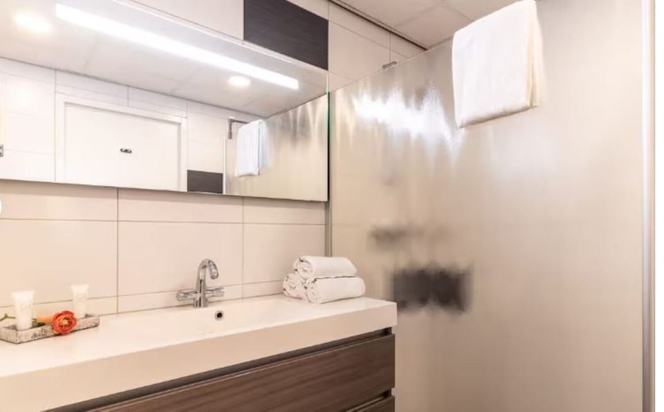 Start your day with a bright vanity and fresh towels.