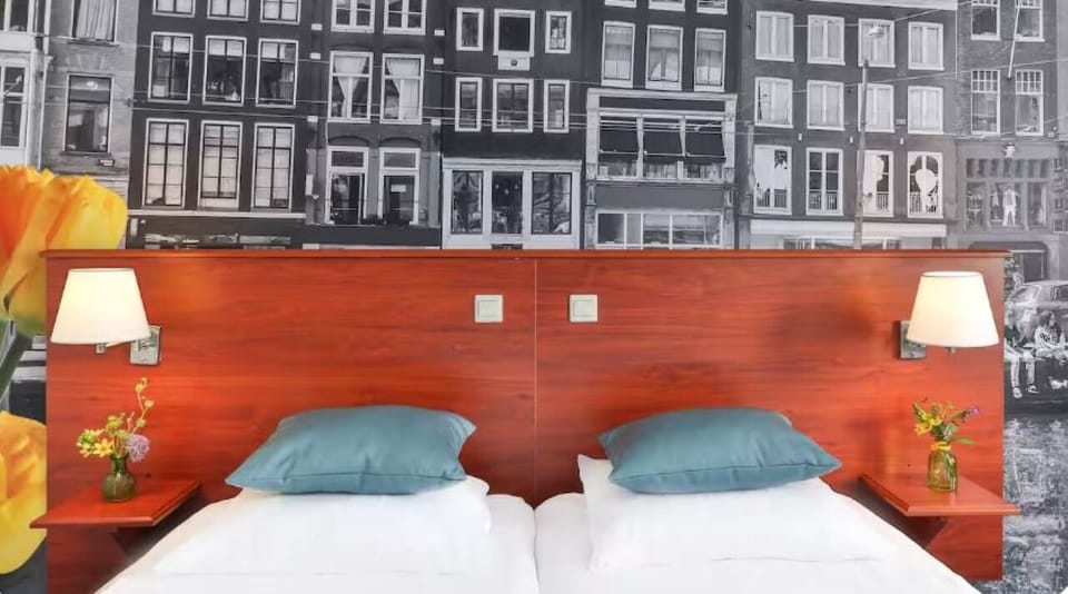 Drift off comfortably with cozy twin setup and soft lighting.