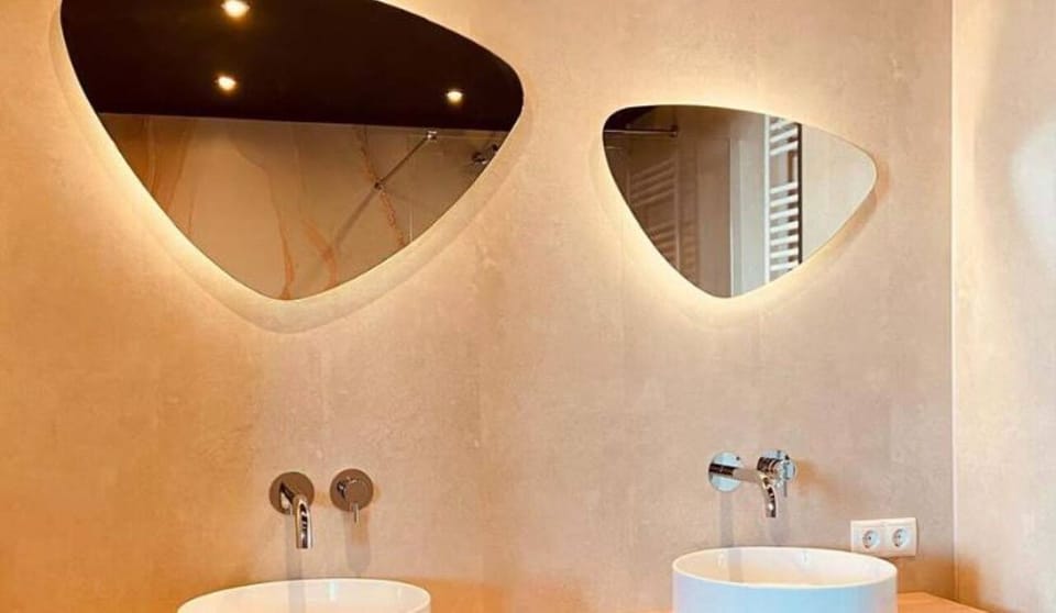 Refresh under a sleek rain shower in a spa-like space.