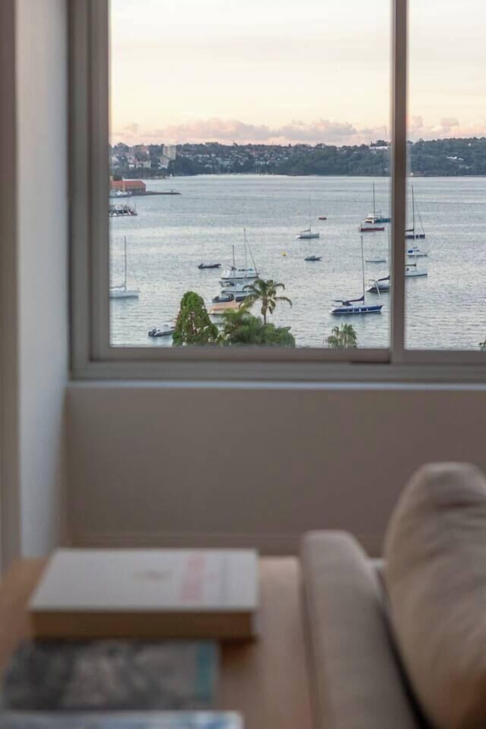 Pause beside the windows as sailboats drift across Elizabeth Bay and the calm harbour outlook becomes part of everyday living.