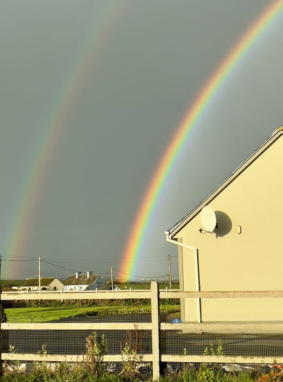 Iconic Irish rainbows over the sea and Mutton Island