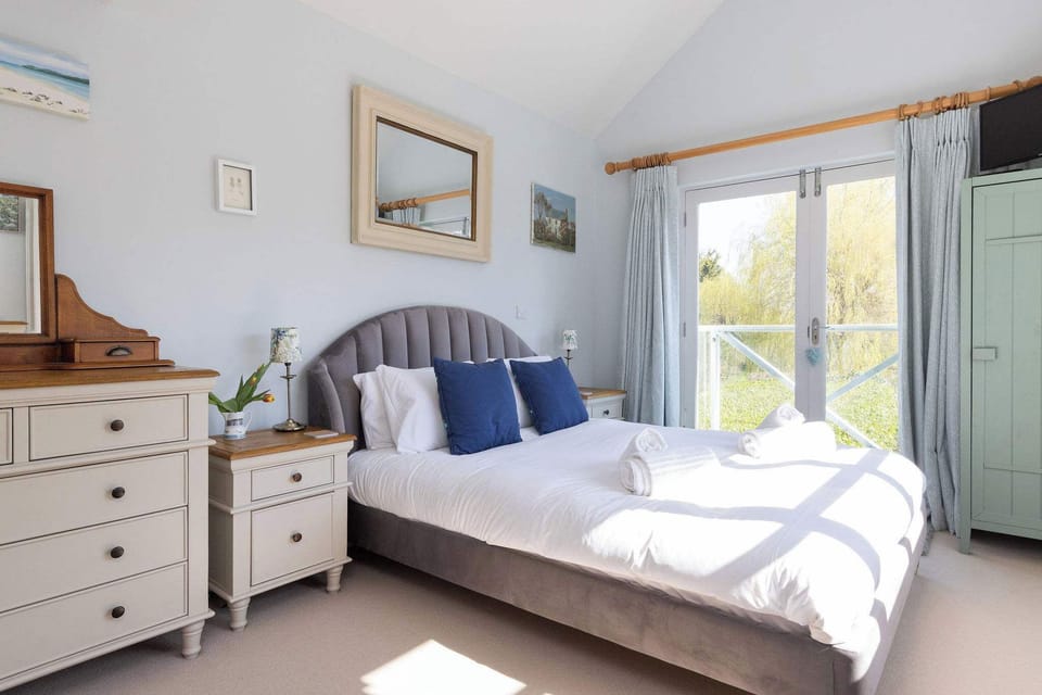 Light-filled bedroom with garden views
