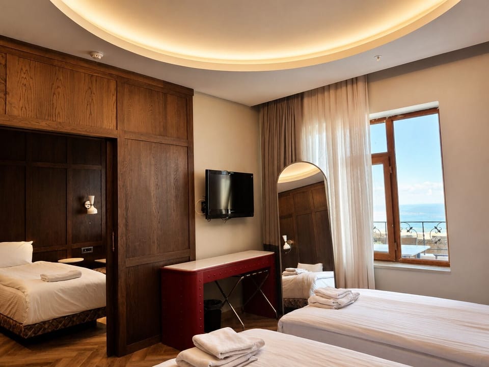 Standard Triple Room | In-room safe, desk, laptop workspace, blackout drapes