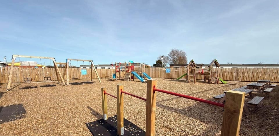 On-site playground with swings, slides and a multi-purpose sports court.