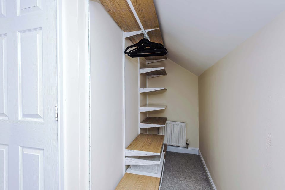 The bedroom on the 2nd floor features beds which can be configured to your liking, as a superking or into 2 x singles. There is a dressing table area to get ready in the morning and a built in wardrobe space for you to hang your belongings.