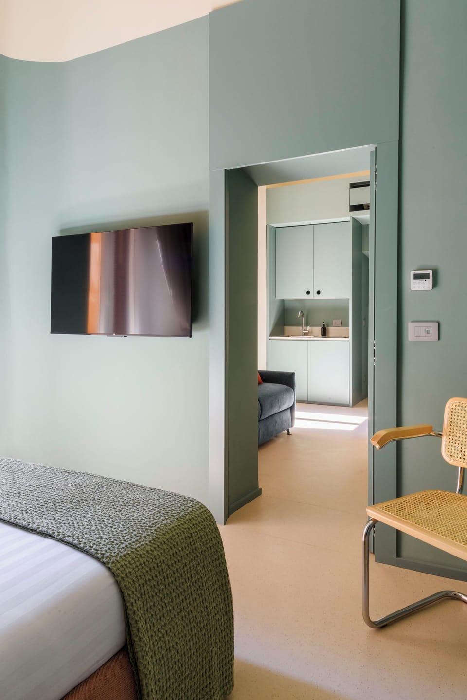 Deluxe Quadruple Room, Balcony | In-room safe, blackout drapes, soundproofing, iron/ironing board