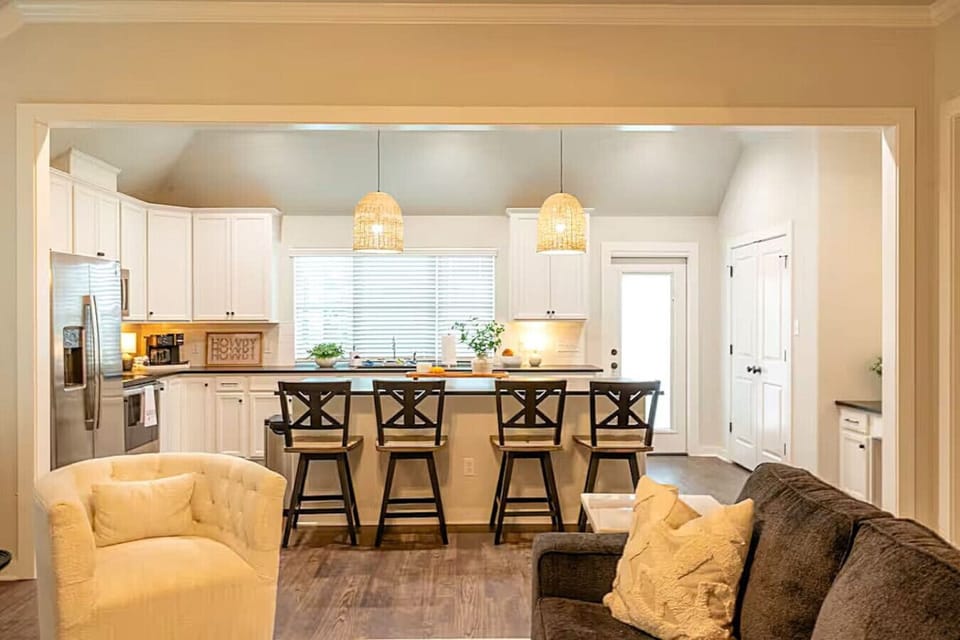 The fully equipped kitchen has everything you need for cooking and casual meals, with a stylish bar area perfect for gathering or enjoying a quick bite.