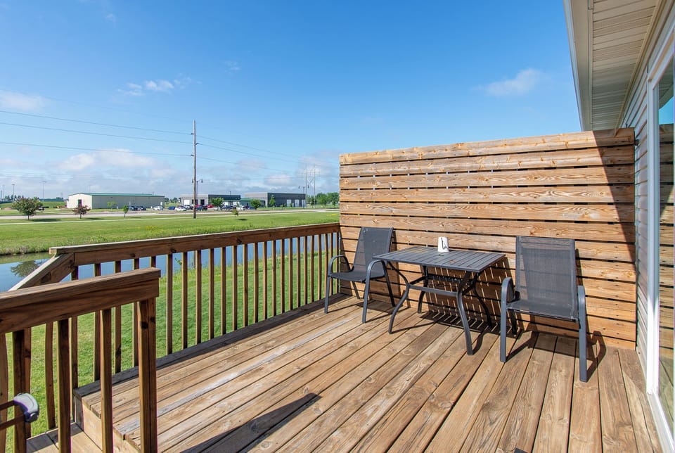 [Exterior] Deck with seating and pond views

