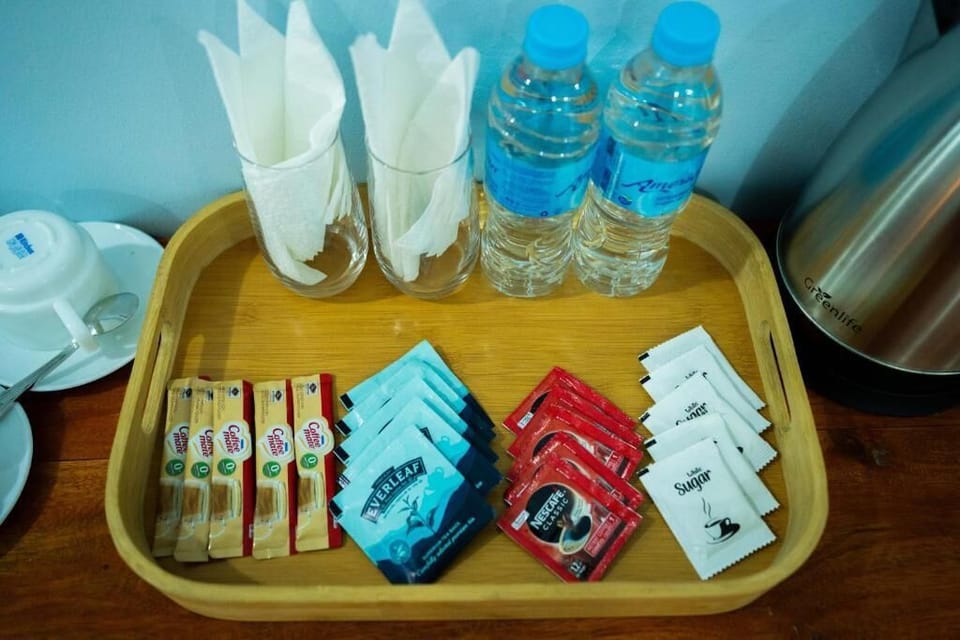 Deluxe Double Room, Balcony, Garden View | Bathroom amenities | Shower, towels, soap, shampoo