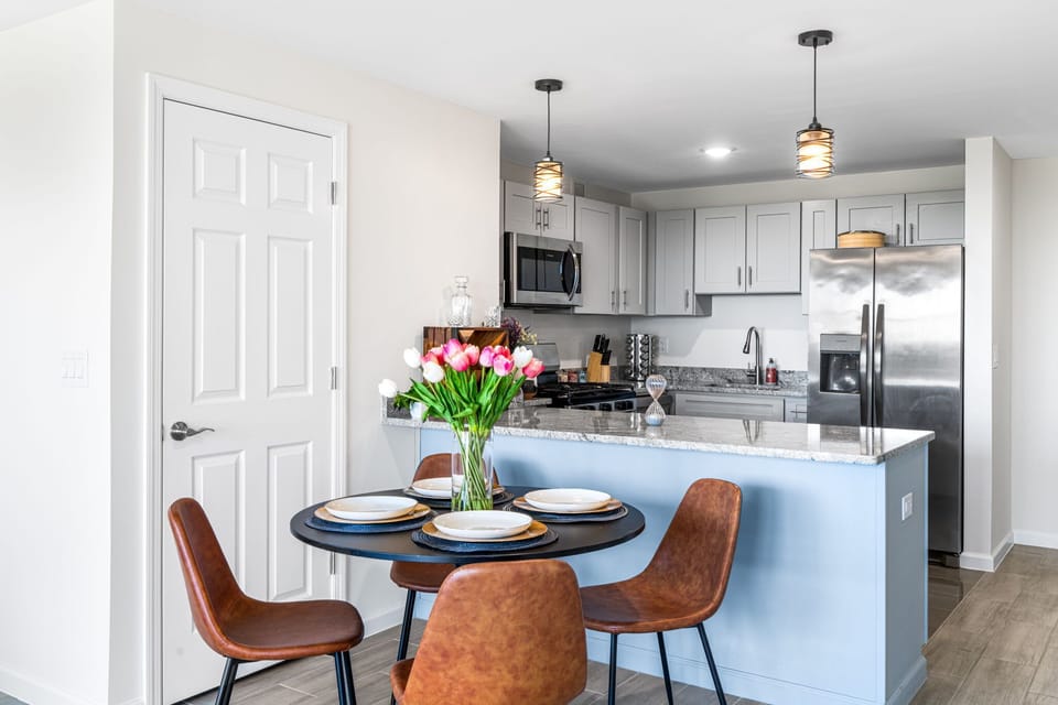 A simple, comfortable dining area connected to the kitchen. Easy for meals, work, or a quick reset.