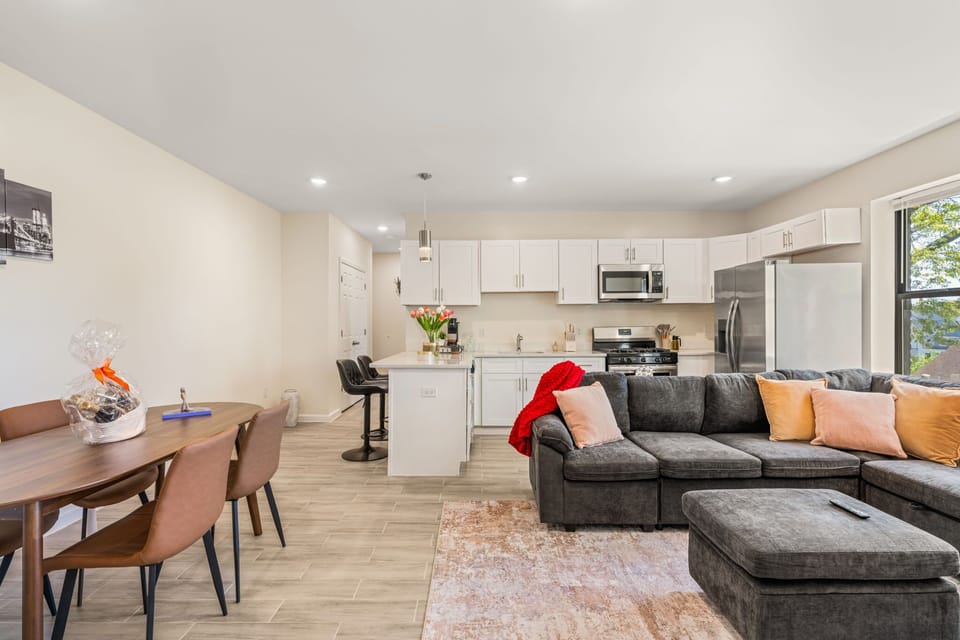 An open, light-filled space that brings everything together, from lounging to dining to cooking, all in one easy flow.