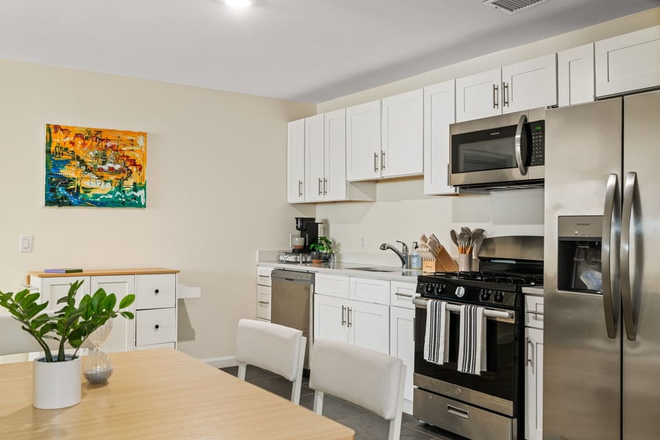 A simple, inviting spot to share meals, get some work done, or plan the day ahead.