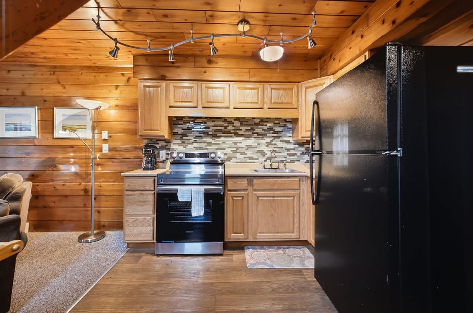 Well equipped kitchen makes family meals easy between lake adventures.