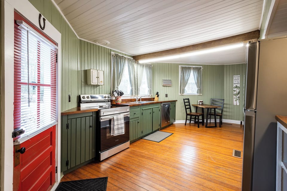 Fully equipped kitchen with modern appliances.