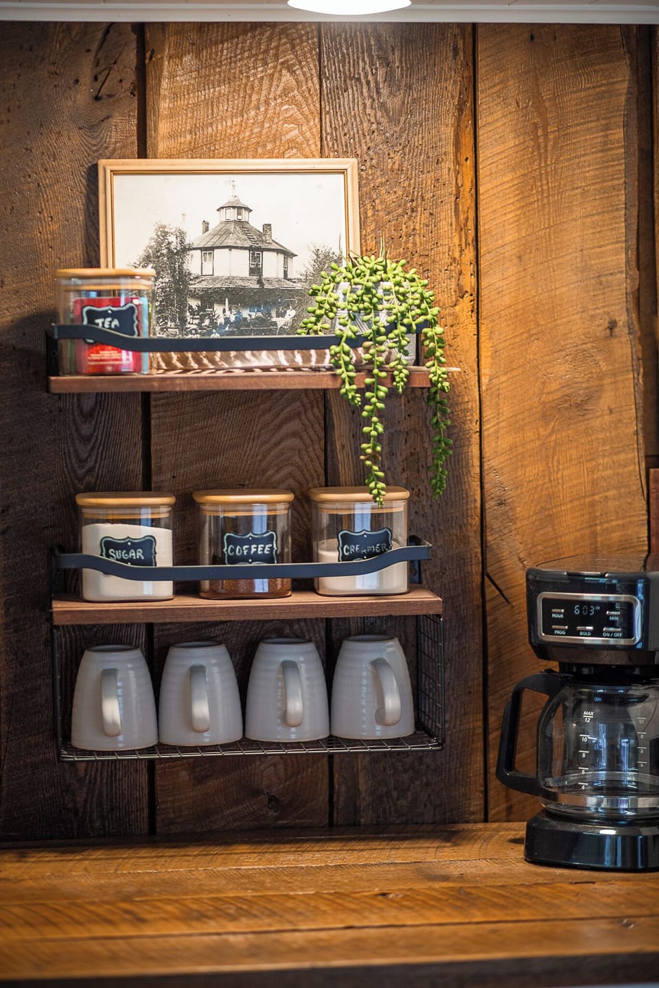 Small coffee bar area with essentials, coffee, tea, creamer and sugar provided.