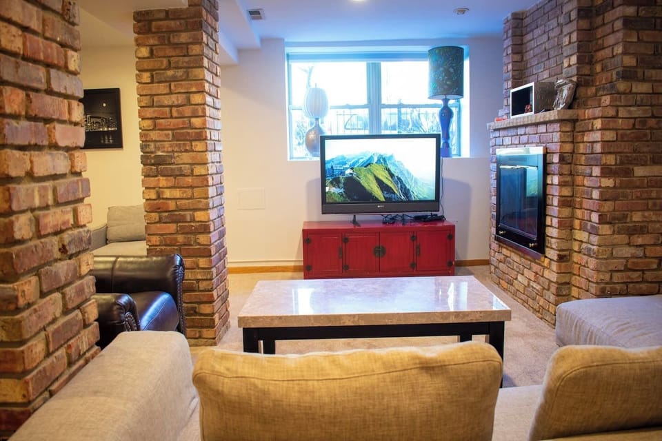 Lounge area with fireplace and TV