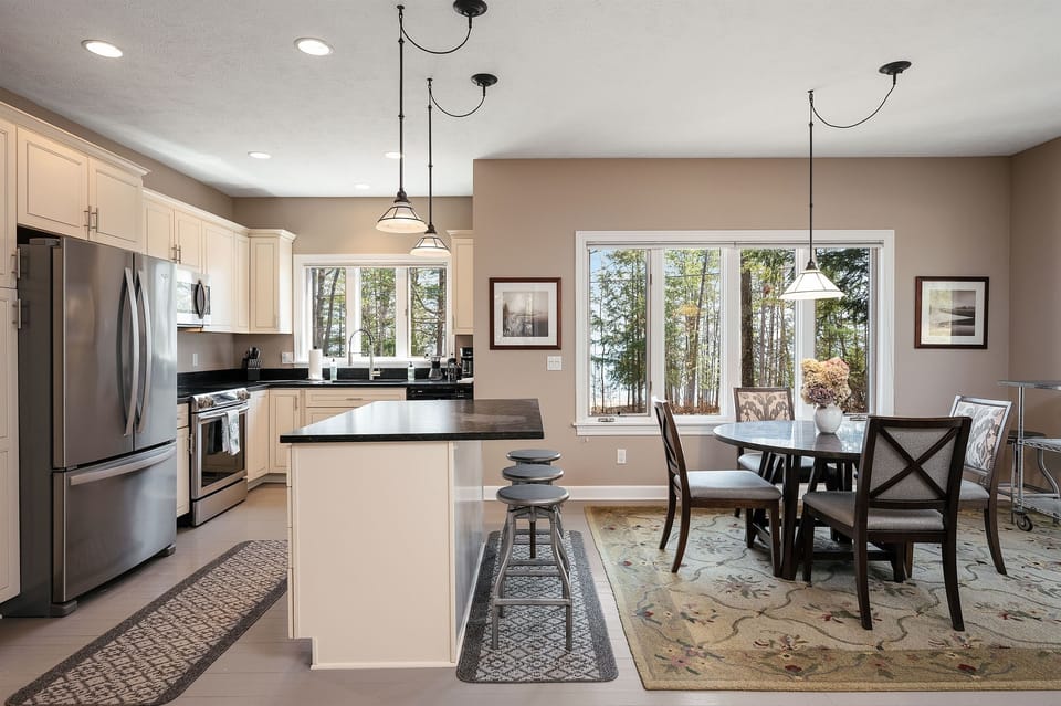 Open layout connecting kitchen and dining. 