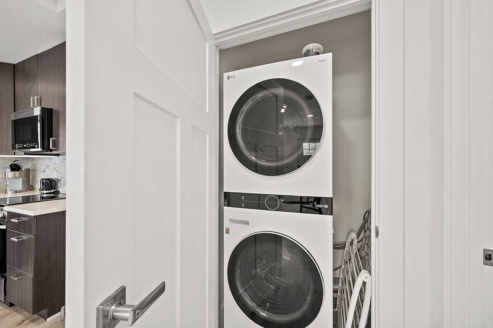 Your own stacked washer and dryer tucked conveniently in-unit means you can pack light and refresh anytime during your stay.