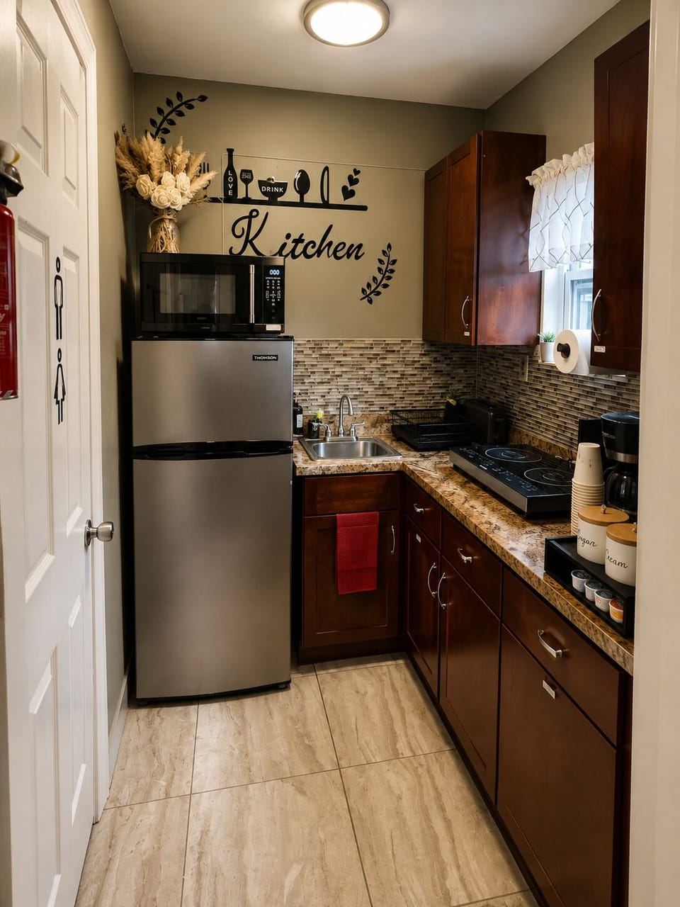 Private kitchenette with refrigerator, microwave and essentials
