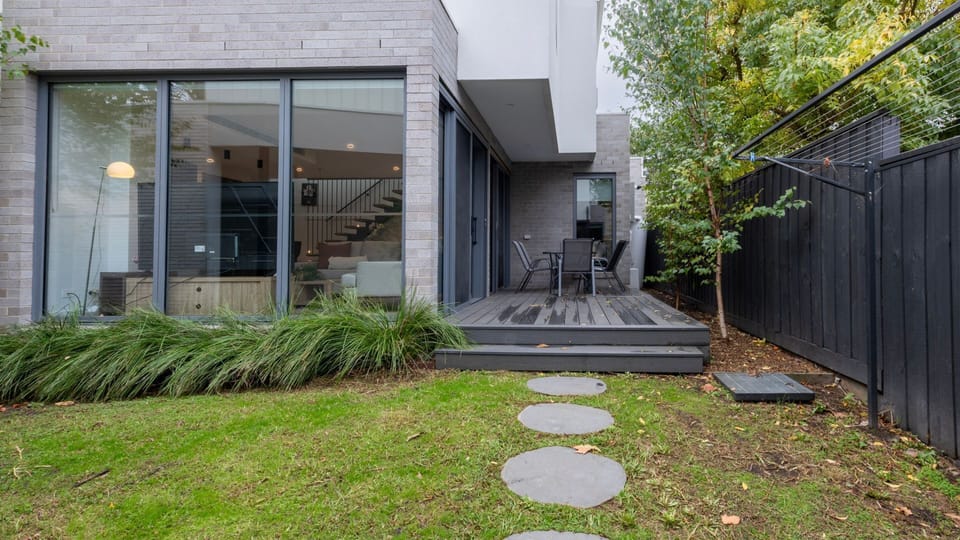 Private outdoor garden space surrounded by greenery.