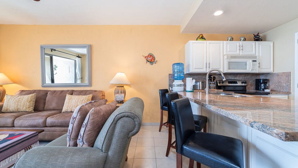 Raised seating at he kitchen counter.