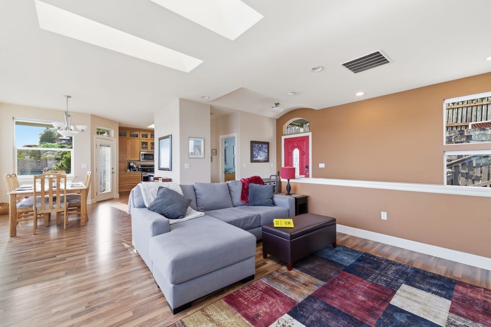 Open-concept living space connects seating and entertainment areas.